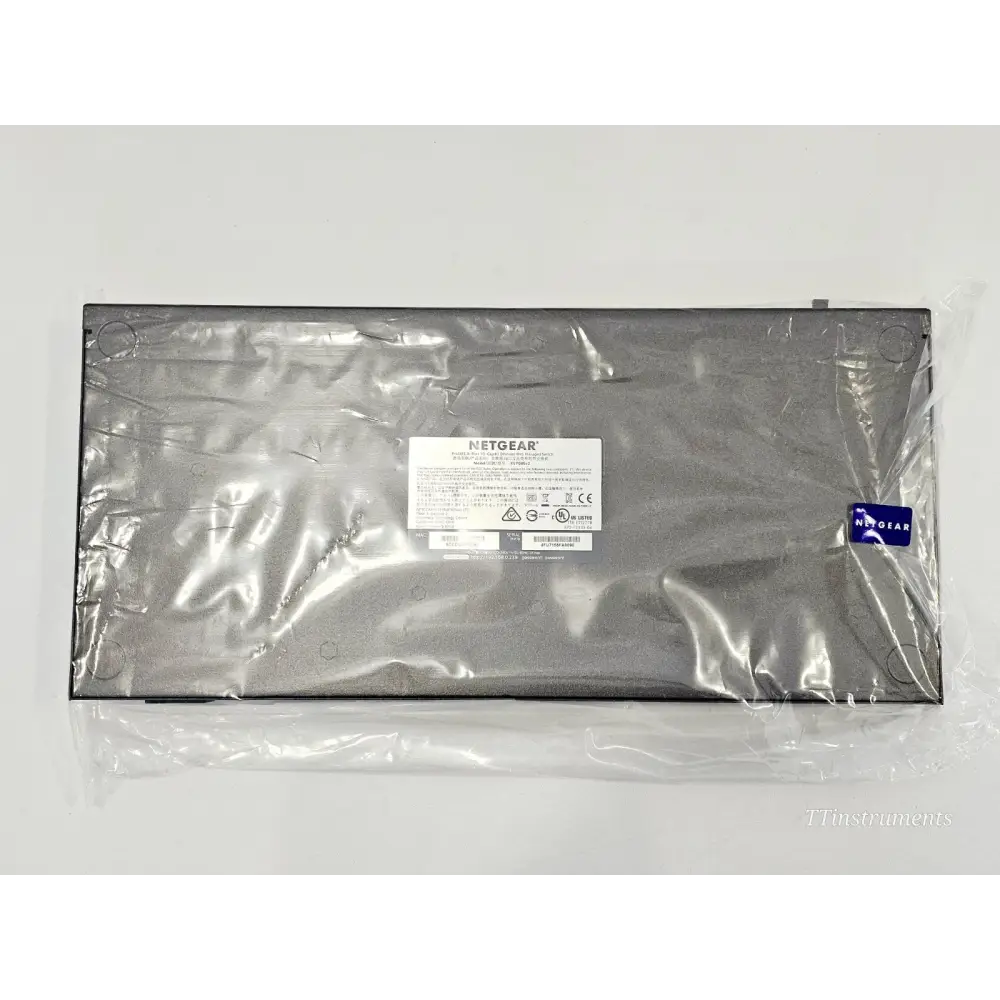 Netgear XS708E-200NES ProSAFE switch bottom label view in anti-static bag showing model and regulatory markings