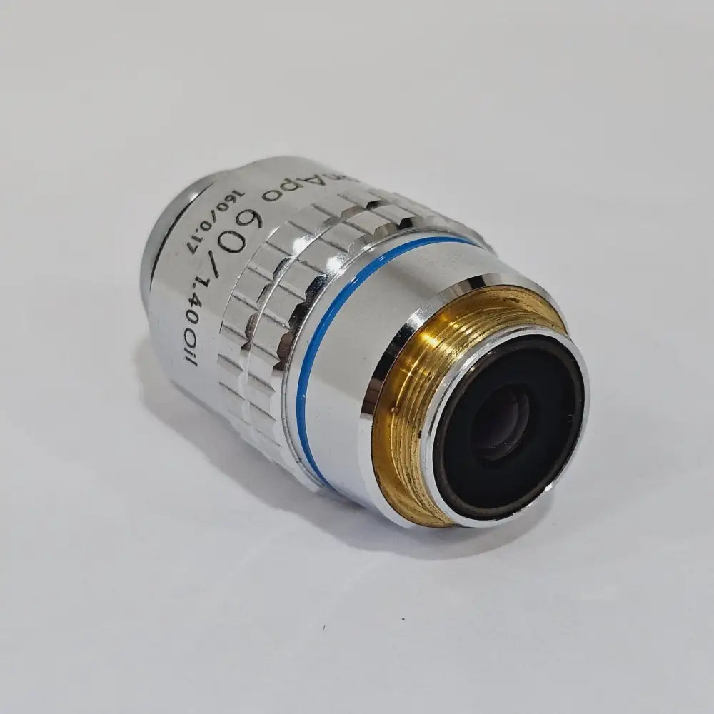 Close-up of Nikon PlanAPO 60x 1.40 Oil objective barrel showing magnification and NA engravings