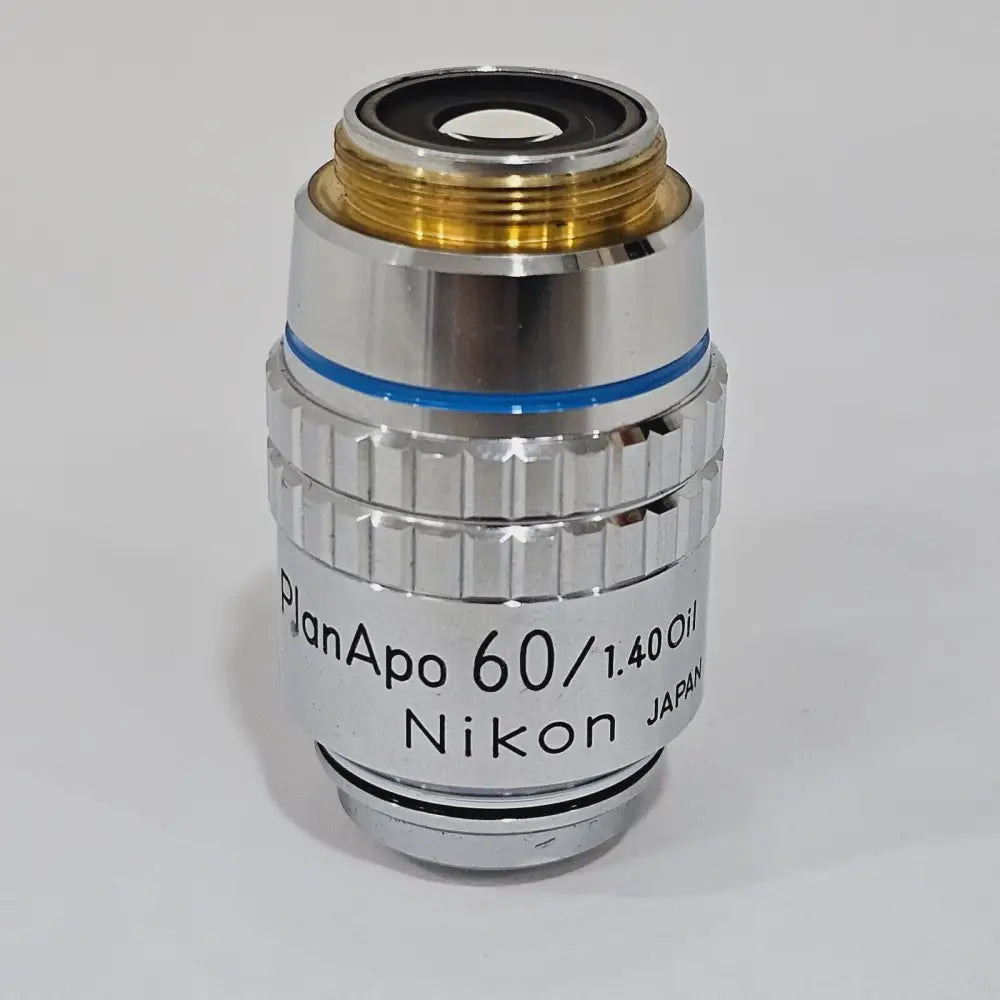 Nikon PlanAPO 60/1.40 Oil 160/0.17 microscope objective, front view showing engraved barrel markings