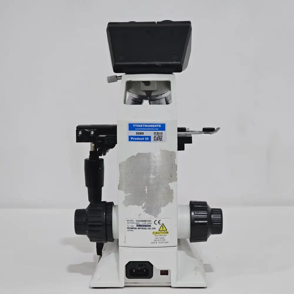 Olympus CH20 Abbe condenser and aperture iris diaphragm beneath the mechanical stage