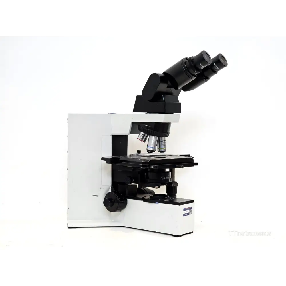 Olympus BX40 microscope front view showing quintuple revolving nosepiece and focus controls