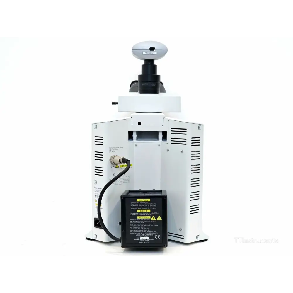 Olympus BX51TF microscope left-side profile showing focus knobs and stage adjustment
