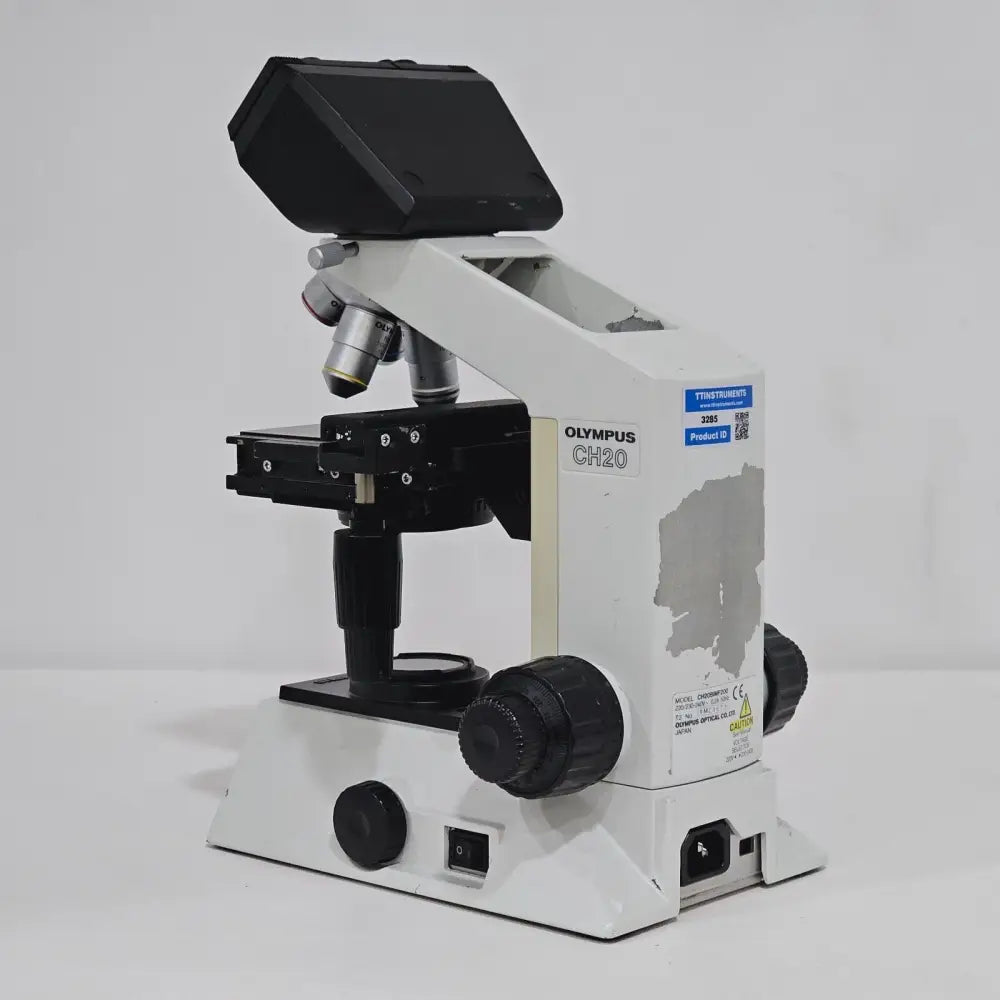 Olympus CH20 Abbe condenser and aperture iris diaphragm beneath the mechanical stage
