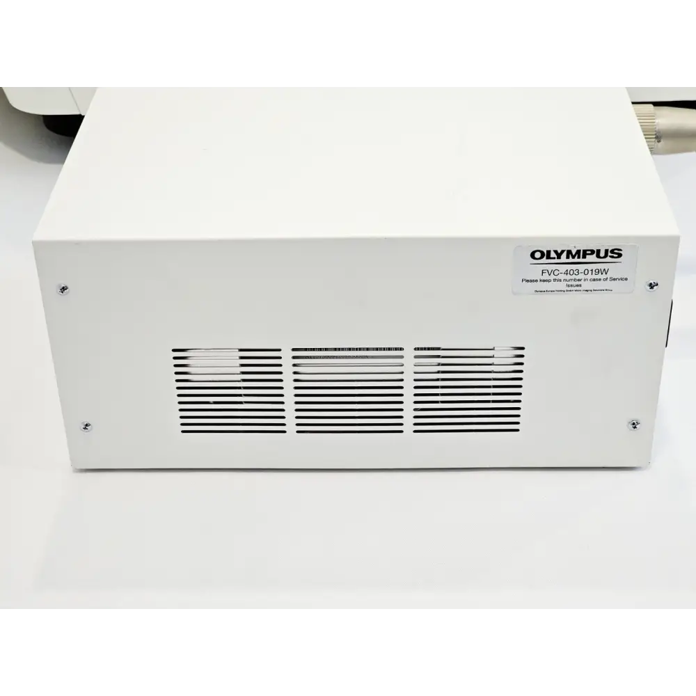 Olympus FV10i external laser combiner module rear showing FVC-403-019W service label and ventilation grilles