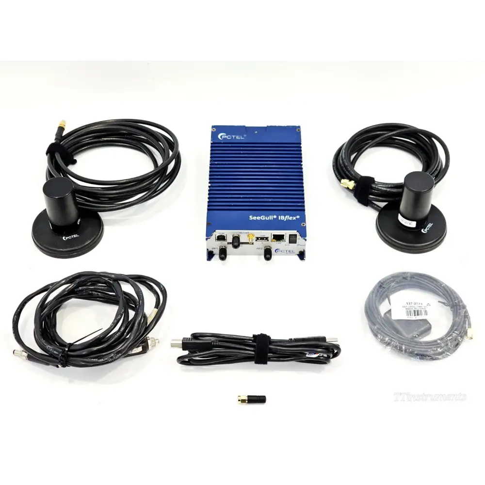 PCTEL SeeGull IBflex 08900S-E scanning receiver with two magnetic-mount antennas, RF cables, and accessories laid out
