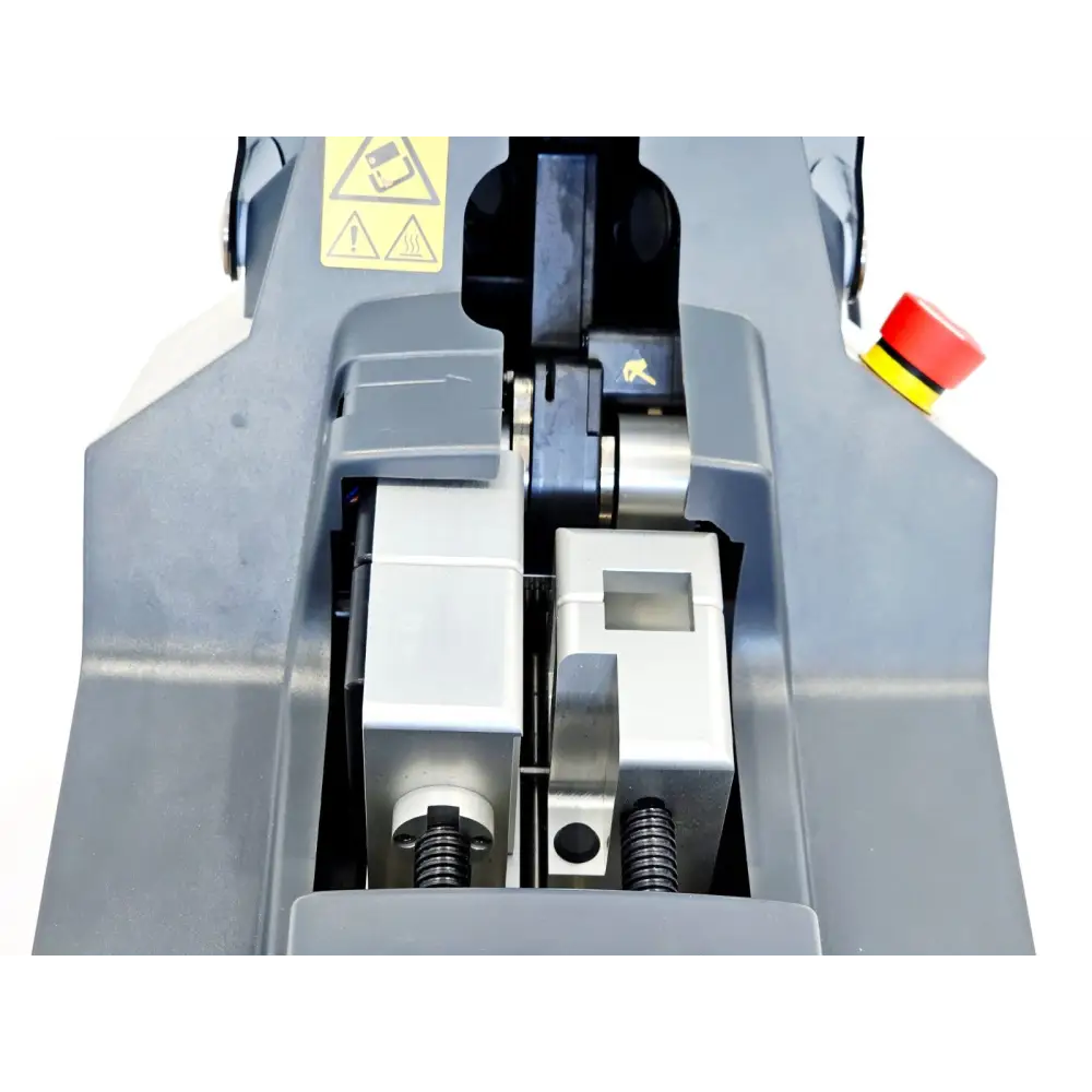 Sartorius BioWelder TC internal welding chamber close-up showing tube holder mechanism, blade slot, springs and safety warning labels