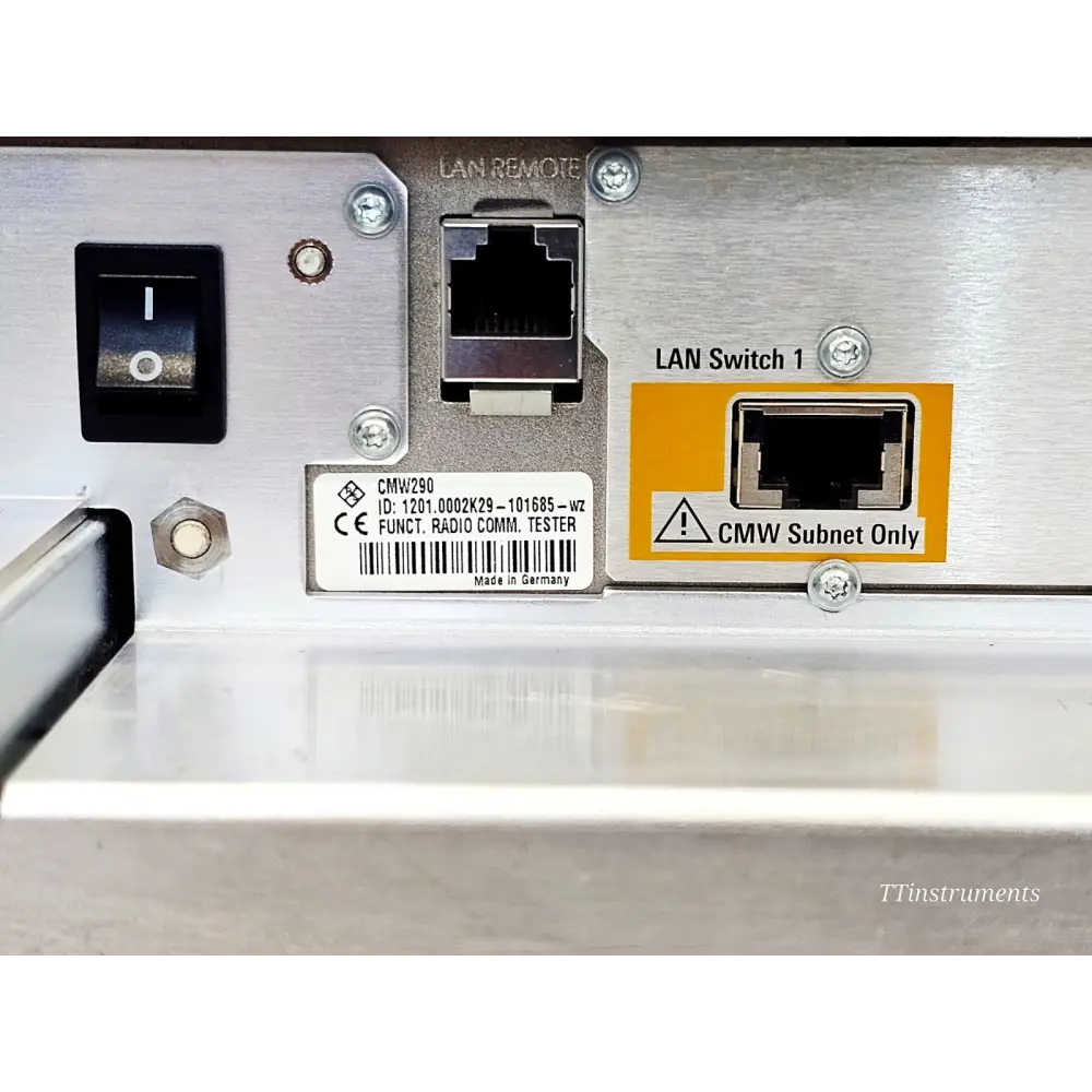 CMW290 rear panel close-up showing serial label ID 1201.0002K29-101685, LAN Remote port, and LAN Switch 1 CMW Subnet Only port