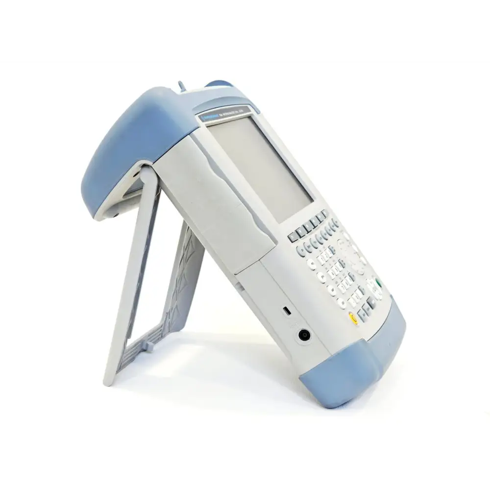 Rohde & Schwarz FSH4 spectrum analyzer right-side view with fold-out stand, showing side panel port and carry handle