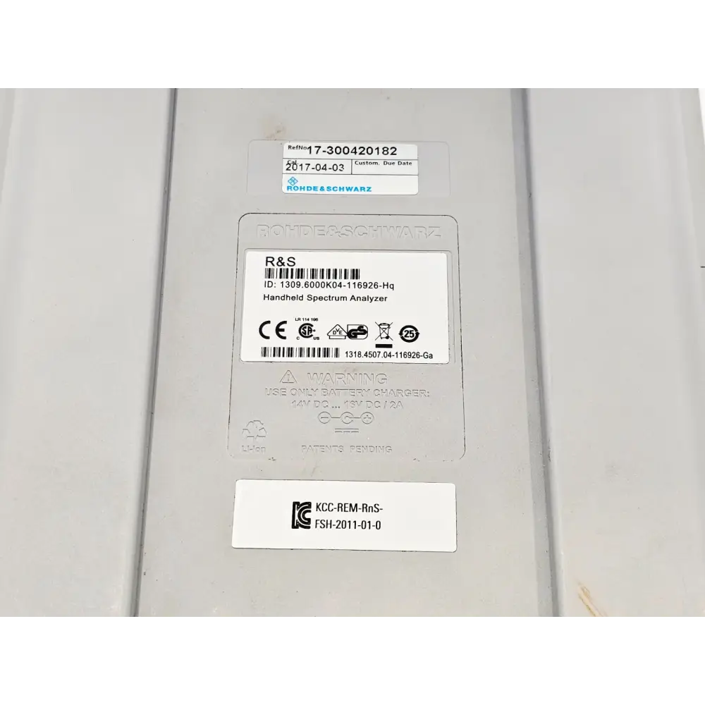 Rohde & Schwarz FSH4 rear label close-up showing serial number 1309.6000K04-116926-Hq, R&S service date 2017-04-03 and regulatory marks