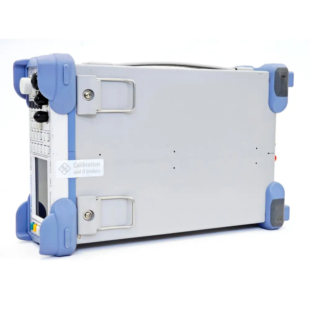 Rohde & Schwarz SMC100A left-side panel showing R&S calibration void sticker intact on chassis