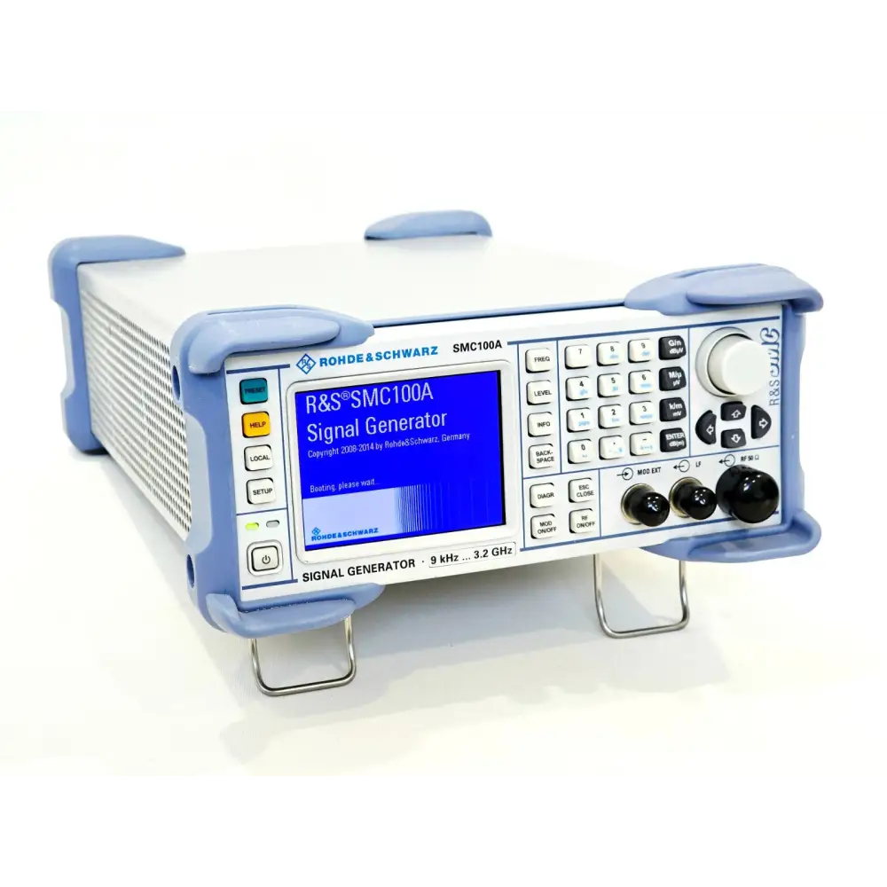 Rohde & Schwarz SMC100A signal generator front panel at angle, boot screen displaying R&S SMC100A Signal Generator