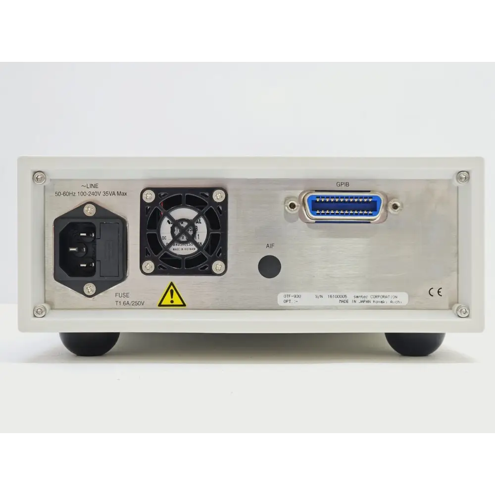 Santec OTF-930 rear panel showing IEC mains inlet, cooling fan, GPIB port and serial number label