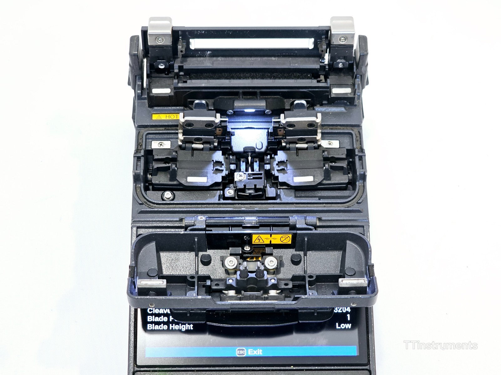 Fujikura FSM-22S fusion splicer side view with AC adapter and sheath clamps