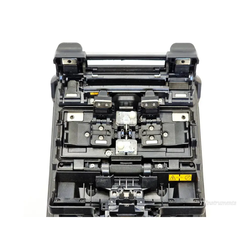 Fujikura 41S fusion splicer top-down view showing V-groove splicing deck, electrodes, and fibre clamp holders