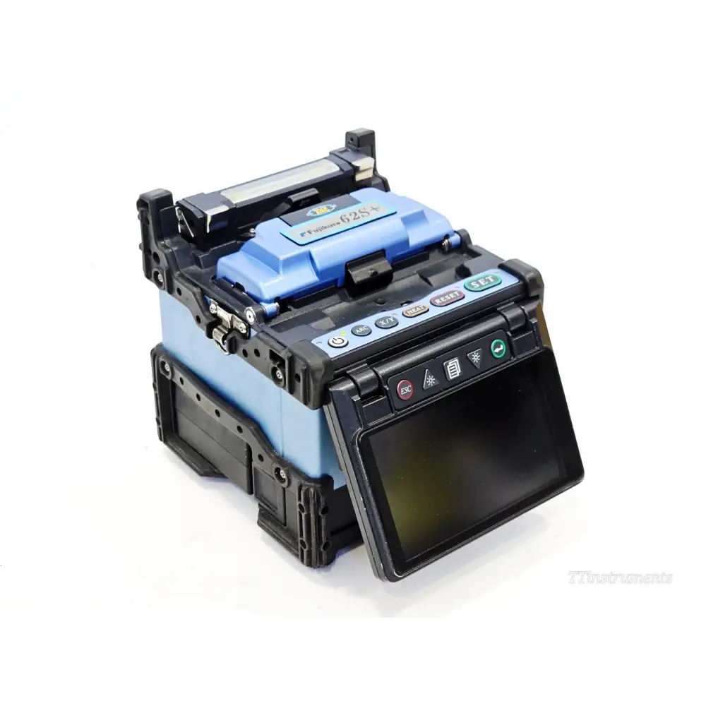 Fujikura FSM-62S+ fusion splicer front-angle view showing colour TFT display, control buttons and wind protector