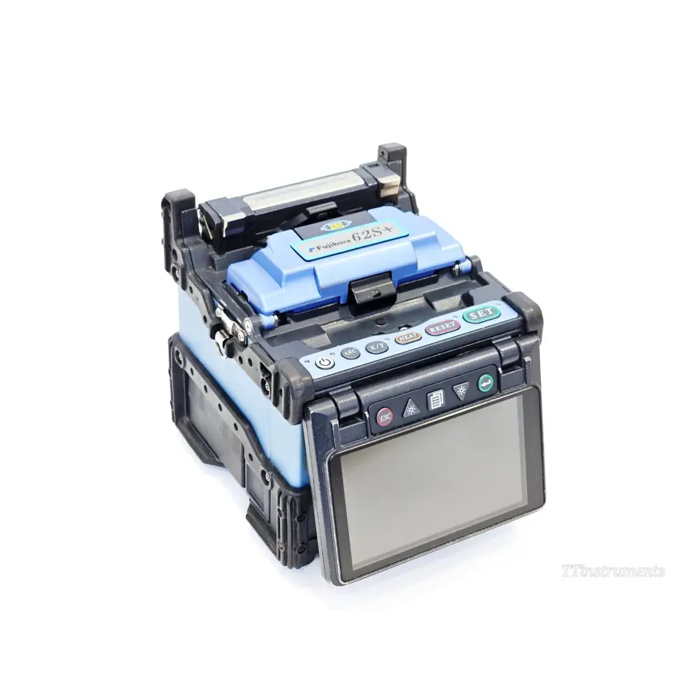 Fujikura FSM-62S+ fusion splicer front-angle view showing blue wind protector hood, TFT display and control buttons