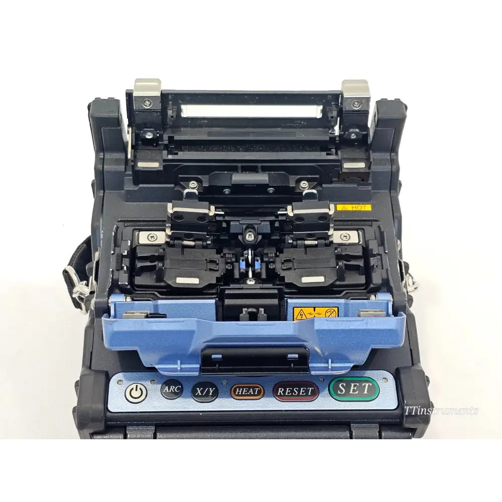 Fujikura 62S+ splicer with AC adapter, battery pack, and accessories laid out