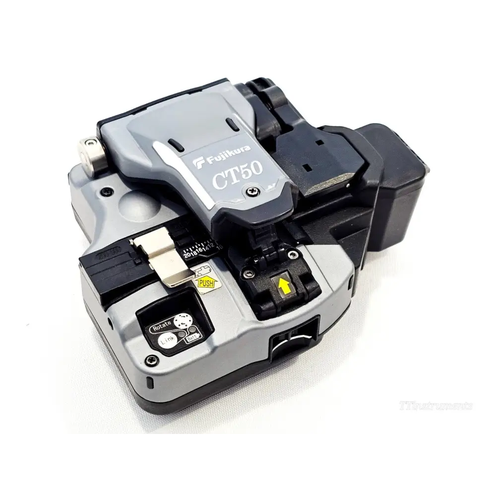 Fujikura CT50 fibre cleaver open view showing blade mechanism, clamp pads and scrap bin compartment