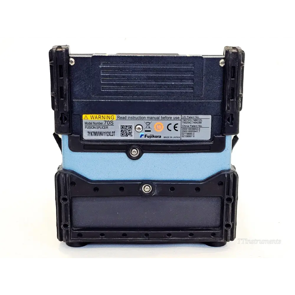 Fujikura FSM-70S fusion splicer rear panel with model label showing serial number 7YK7MVVNV1Y2XLDT and CE marking