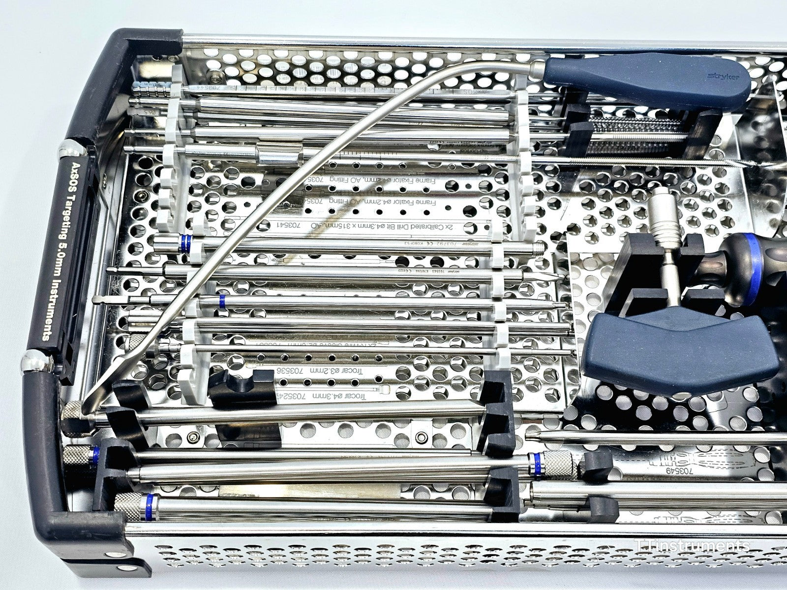 Stryker AxSOS Targeting 5.0mm tray close-up showing engraved part numbers on taps, trocars and drill sleeves