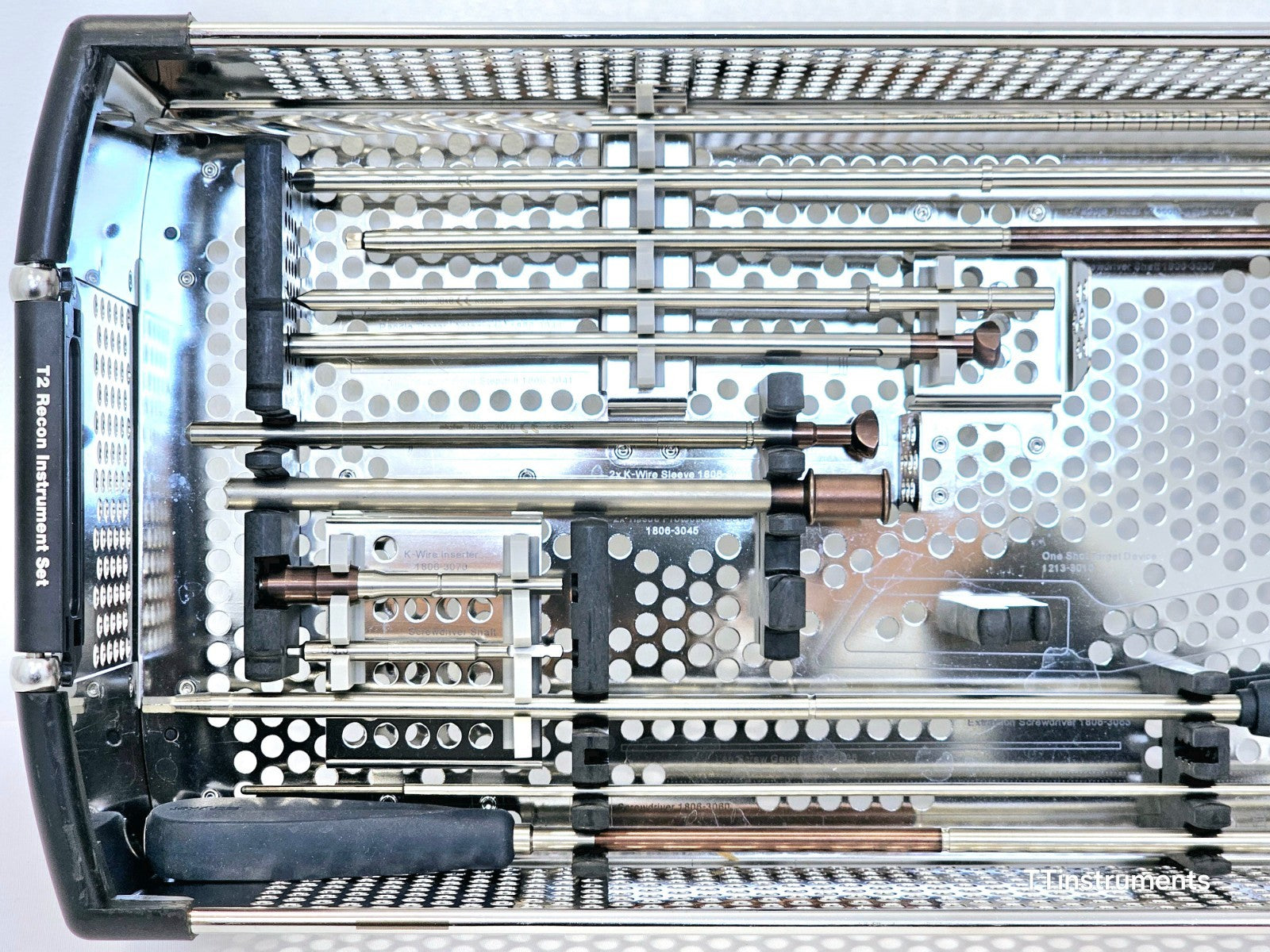 Stryker T2 Recon Instrument Set close-up of upper tray showing K-wire inserter, bronze-coded drill sleeves and extraction screwdriver