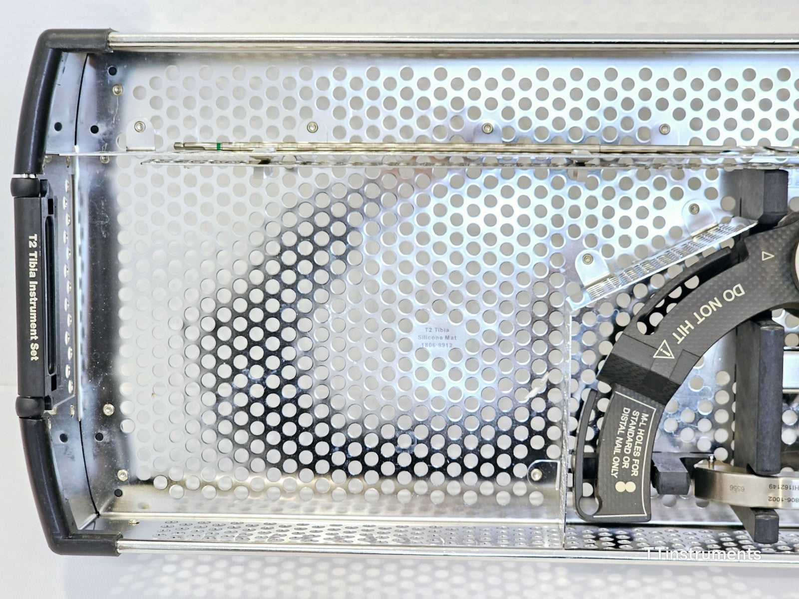 Stryker T2 Tibia Instrument Set tray interior overhead view showing silicone mat ref 1806-9912 and targeting arm