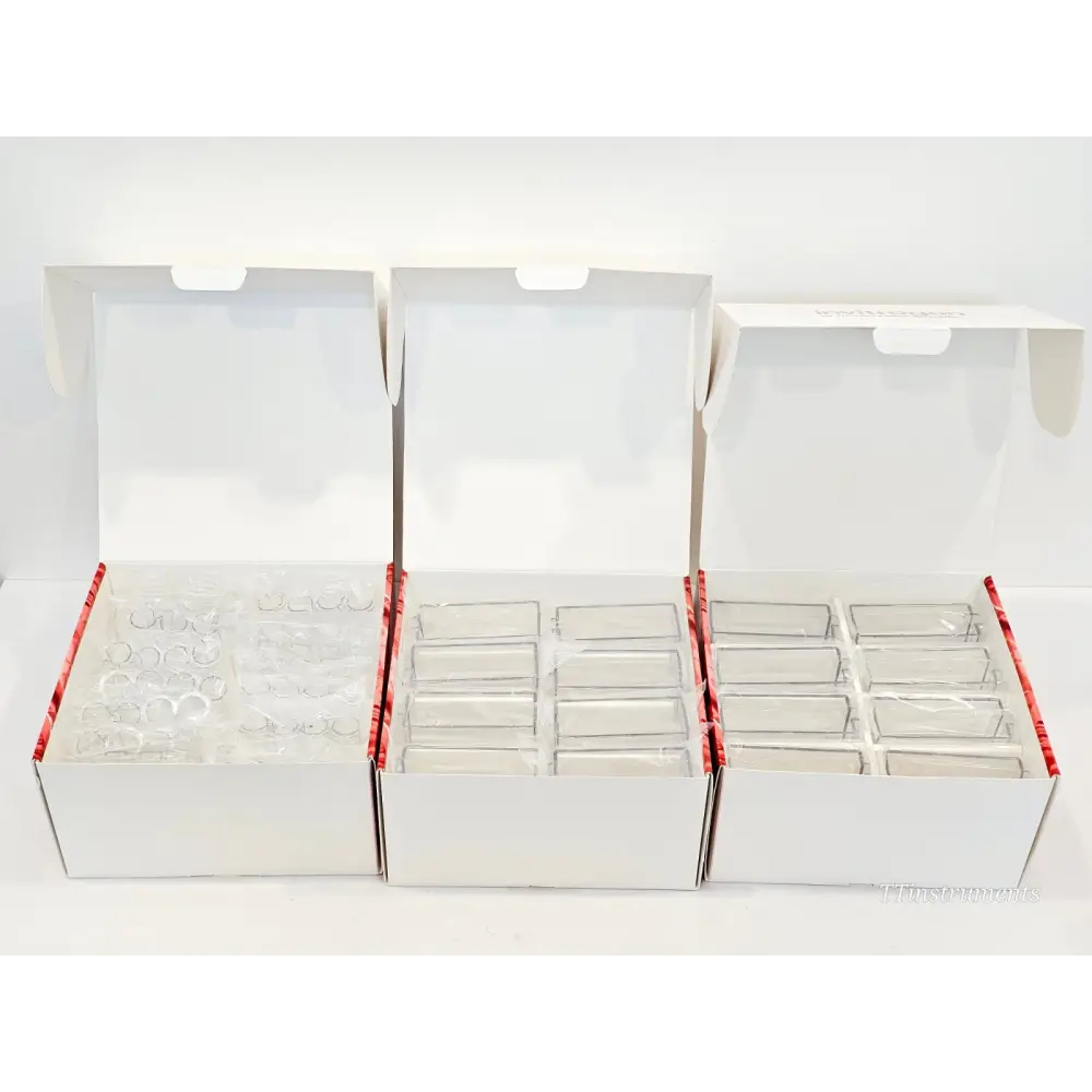 Three open Invitrogen Neon NxT consumable boxes showing clear disposable tips, 8-channel cuvette tubes, and single-channel tubes