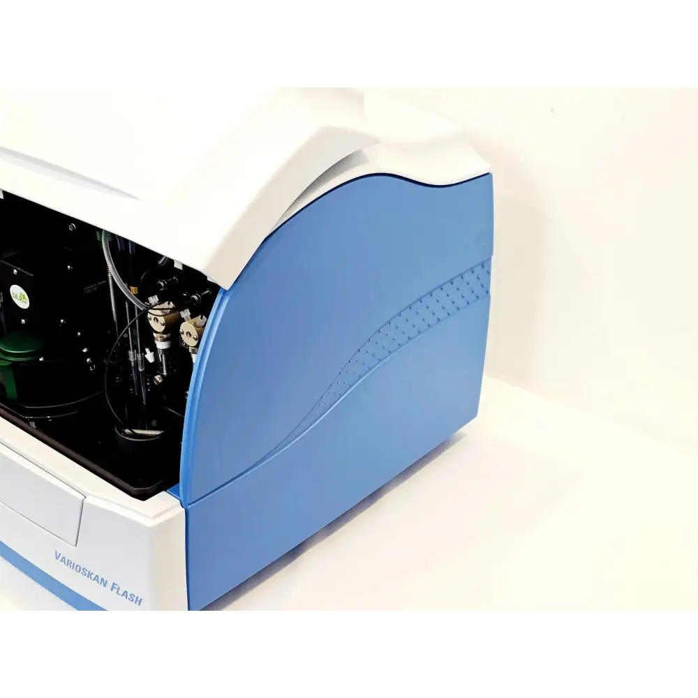 Varioskan Flash microplate reader right-side angle view, lid open showing internal dispensing and optical components