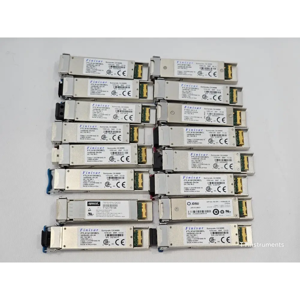 Close-up detail of mixed optical transceiver modules showing various form factors and labelling