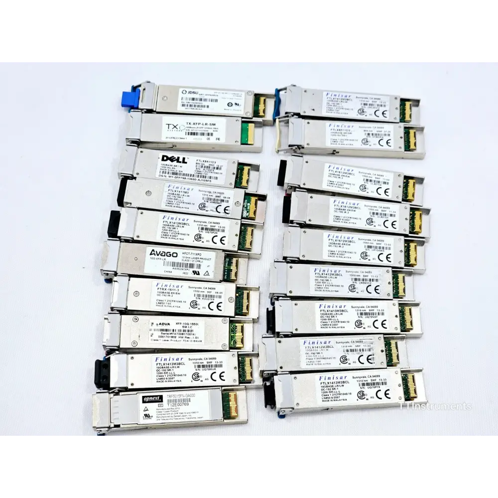 Close-up of assorted JDSU optical transceivers in untested job lot showing module labels