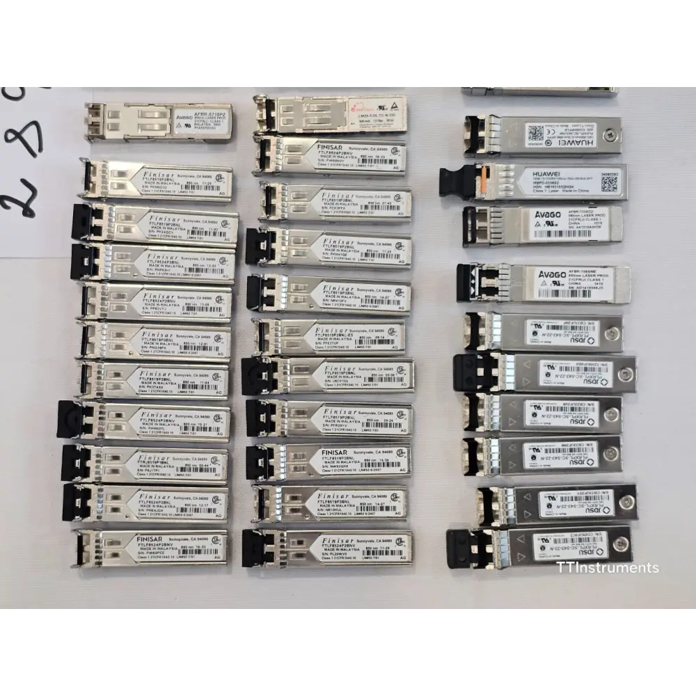 Close-up detail of mixed optical transceiver modules showing various form factors and labelling