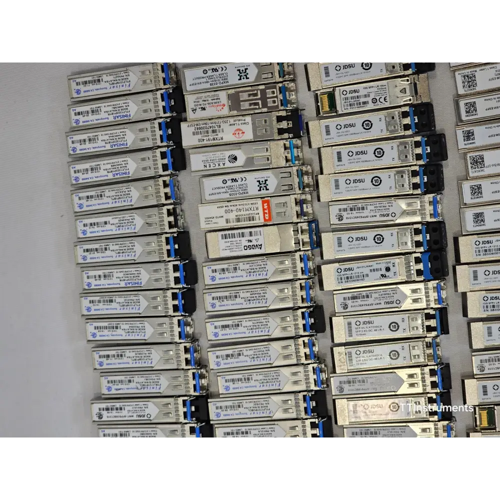 Close-up detail of mixed optical transceiver modules showing various form factors and labelling