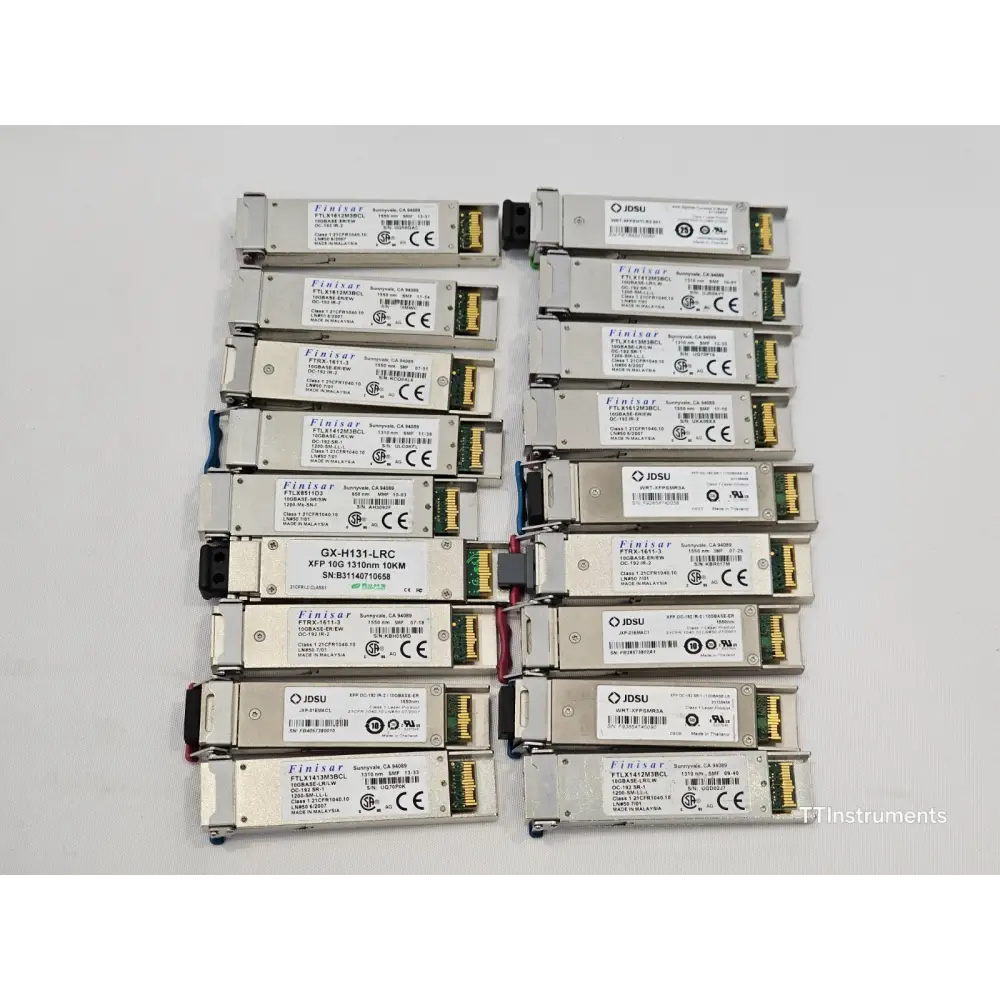 Close-up detail of mixed optical transceiver modules showing various form factors and labelling