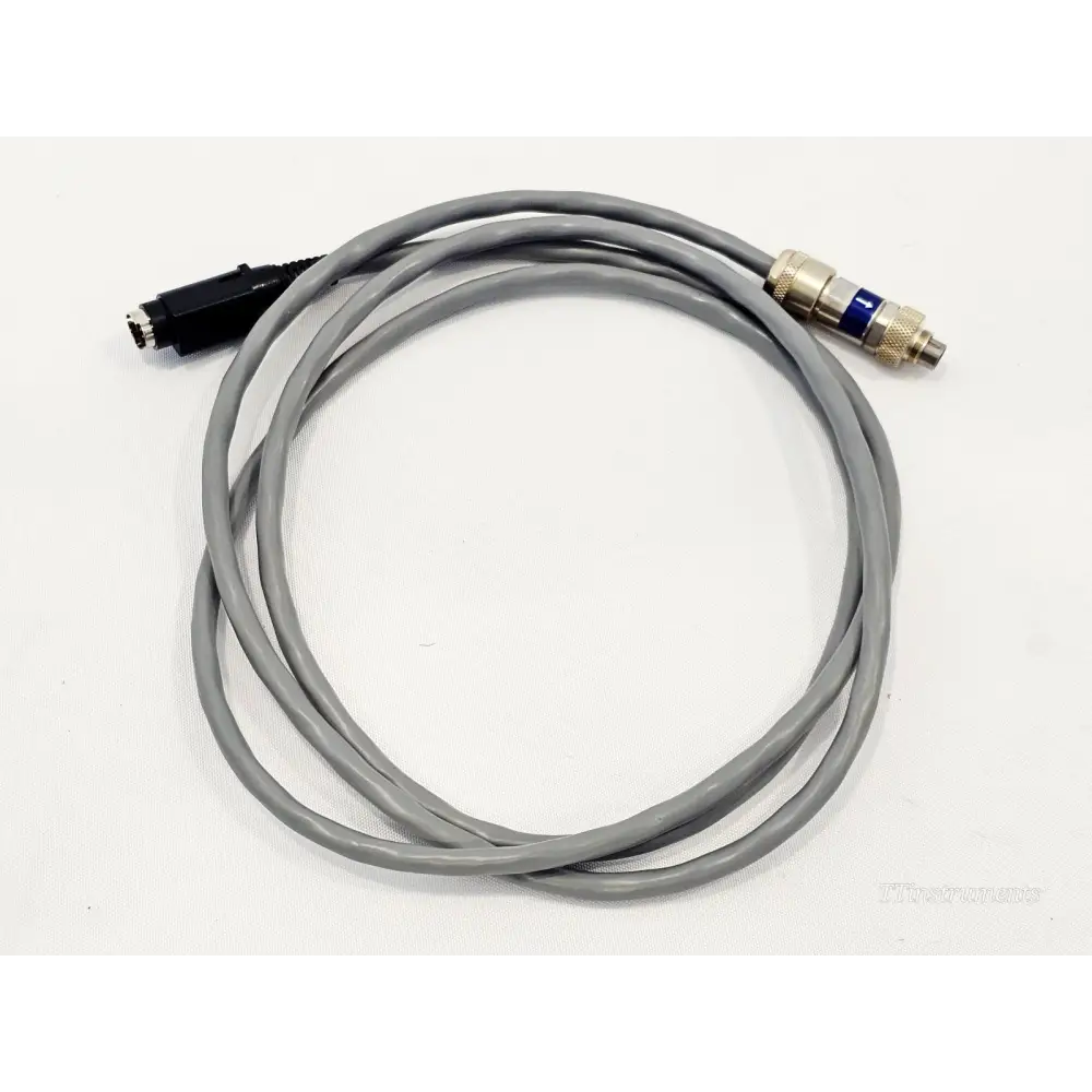 VIAVI E980TUXOSX OSX8000 to OTU-8000 long interconnect cable coiled, showing both end connectors