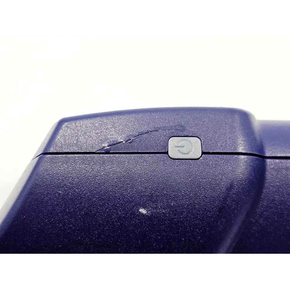 VIAVI FiberChek FIT-FC-KIT3 top body close-up showing cosmetic crack damage on blue plastic housing near power button