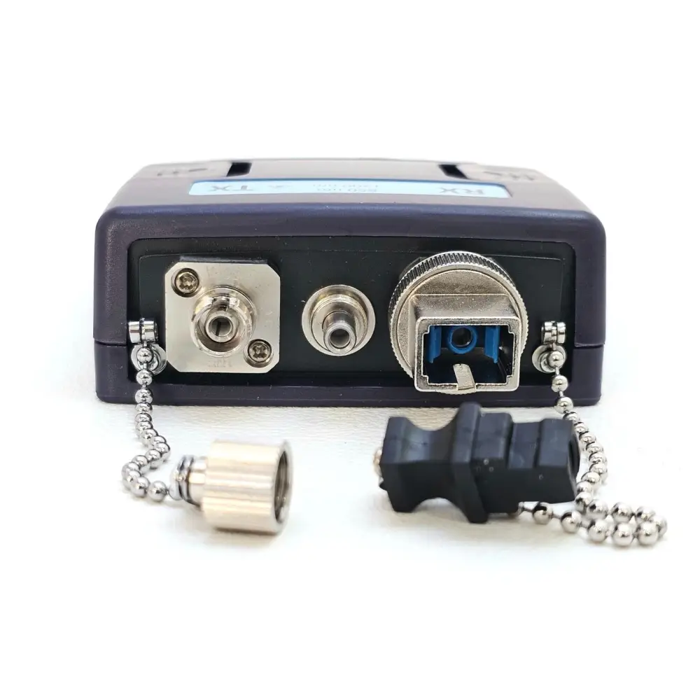 Viavi NGC_AD_EF_MM1 bottom view showing dual FC transmitter ports, LC receiver port, and dust cap accessories