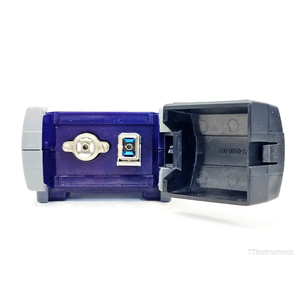 JDSU OLT-55 bottom panel showing USB-B port, DC power jack, and open empty battery compartment