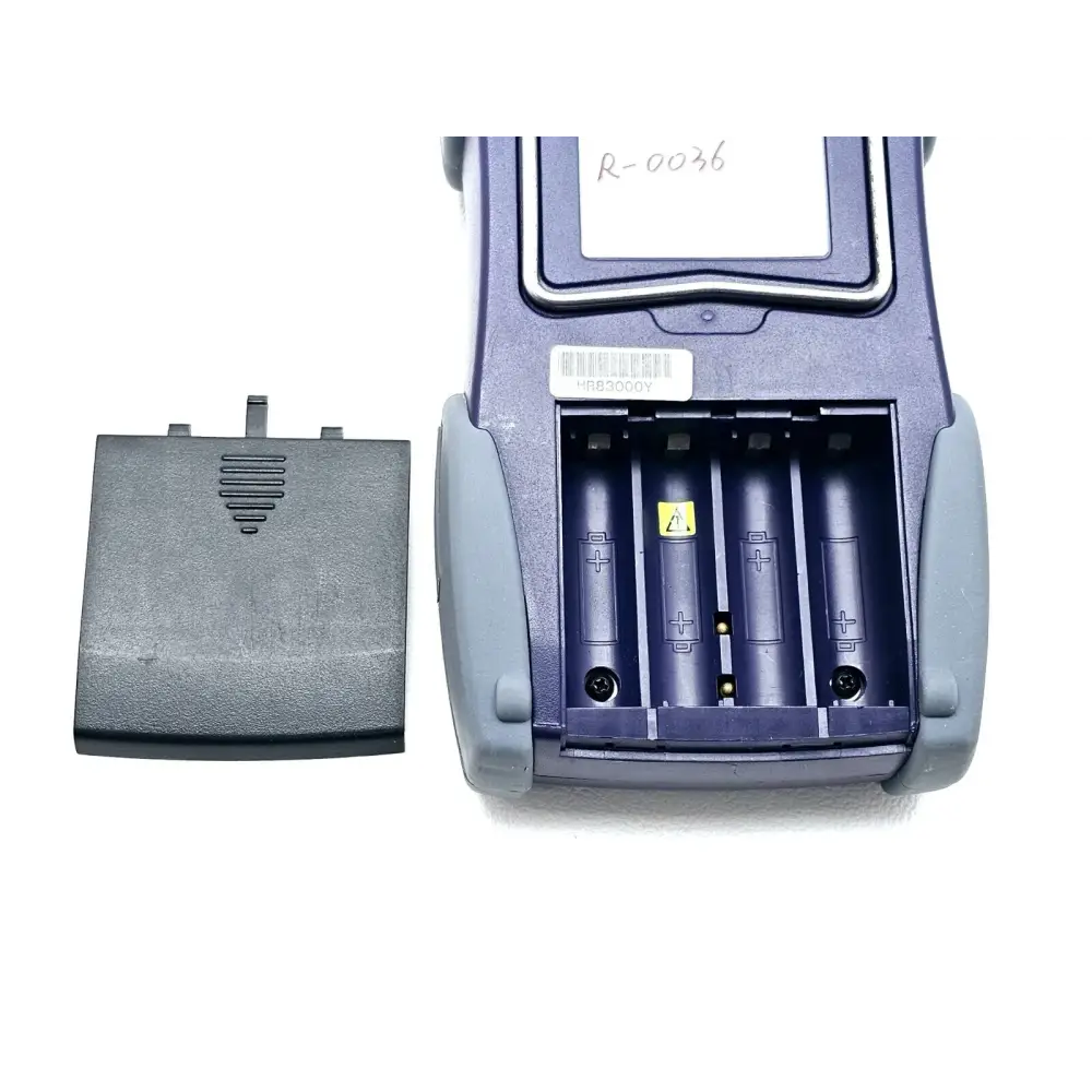 JDSU OLT-55 SmartClass OLTS rear view with battery compartment open showing four AA battery slots and cover