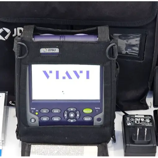 JDSU T-BERD 2000 mainframe powered on showing VIAVI boot screen, in soft carry case with AC adapter