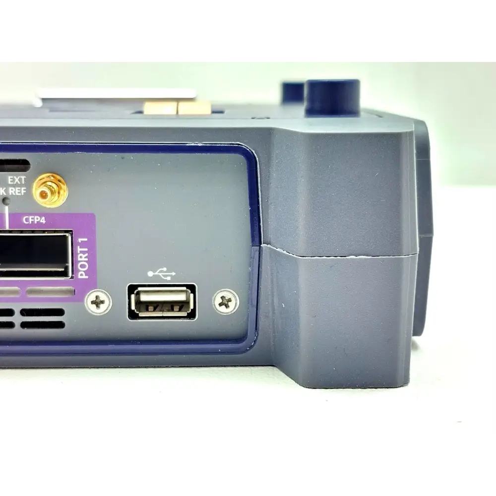 Viavi TM100GA 100G Module right-side close-up showing CFP4 Port 1, EXT CLK REF SMA connector, and USB Type-A port