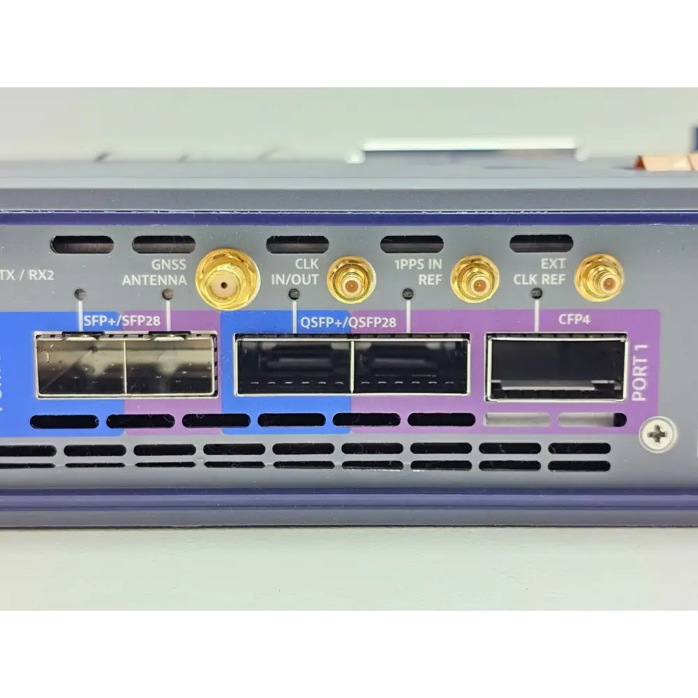 Viavi TM100GA 100G Module Port 1 close-up showing SFP28, QSFP28, CFP4 slots and GNSS, CLK, 1PPS, EXT CLK SMA connectors