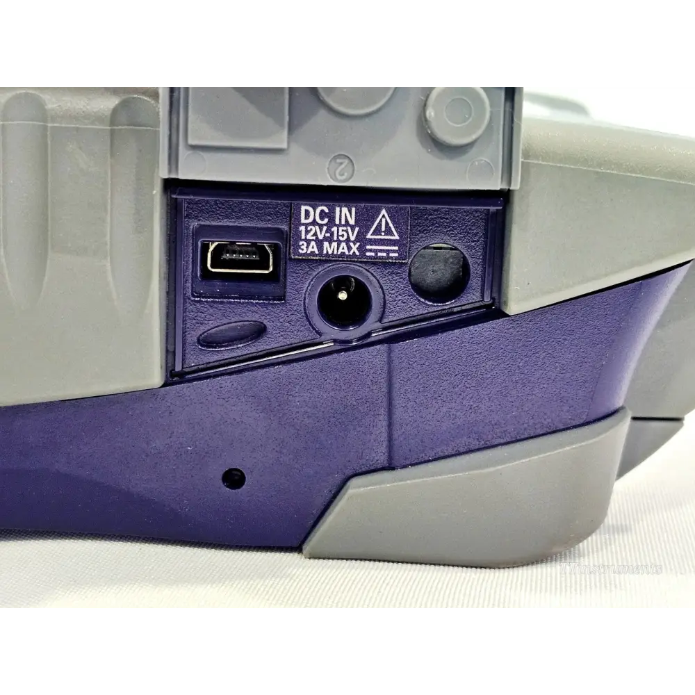 VIAVI SmartOTDR E118FA65 side panel close-up showing DC IN 12V–15V 3A MAX power input and mini-USB port