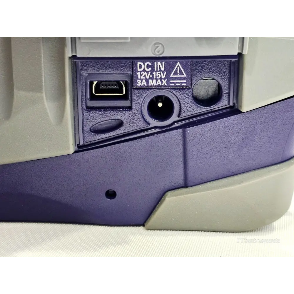 VIAVI SmartOTDR E118FA65 side panel close-up showing Mini-USB port and DC IN 12V–15V 3A MAX power input socket