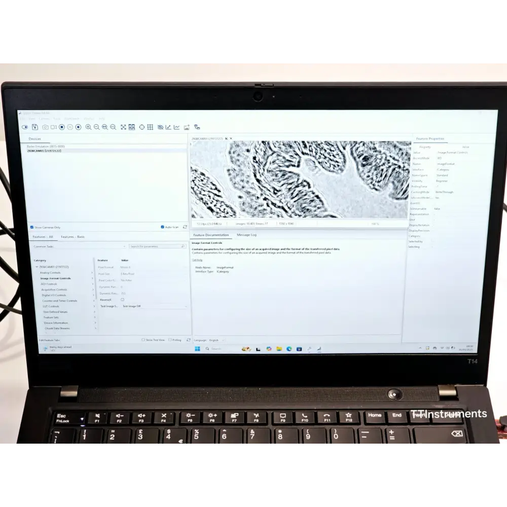 Lenovo ThinkPad T14 laptop screen showing Basler Pylon software with Axio Observer Z1 live monochrome microscope image